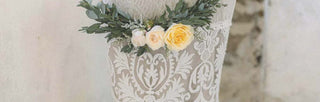 vintage lace wedding dress with yellow roses in a wreath with greenery