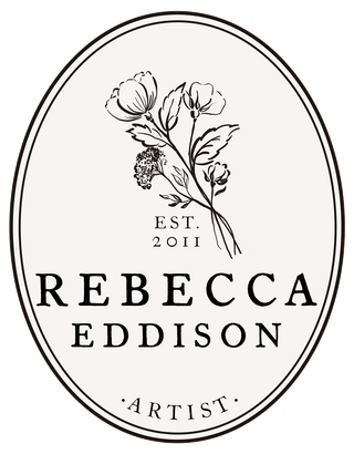 linen and black oval logo of Rebecca Eddison artist with a floral bouquet hand drawn in the center